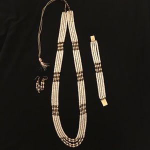 Faux pearl and stone necklace set.